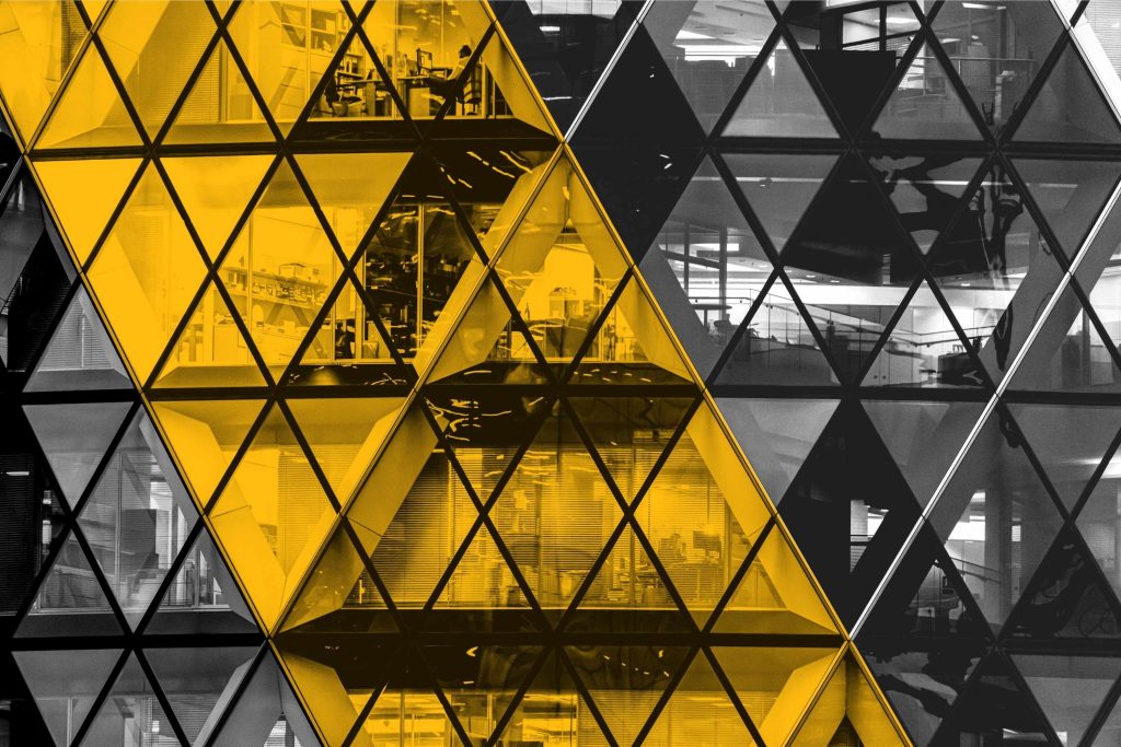 Front of The Gherkin, London, with a view into office spaces
