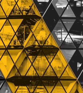 Front of The Gherkin, London, with a view into office spaces