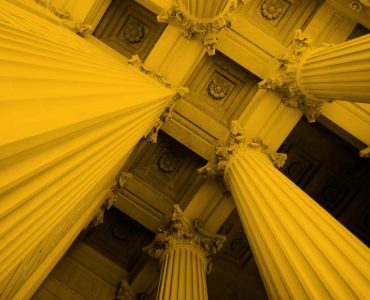 Upwards photo of bank or finance building columns