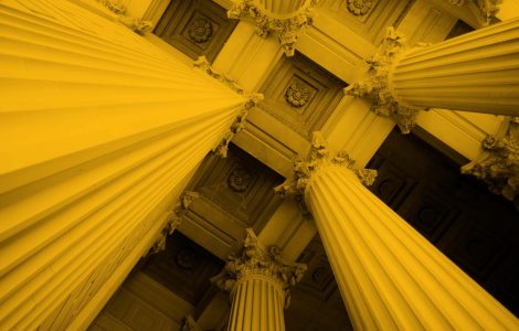 Upwards photo of bank or finance building columns