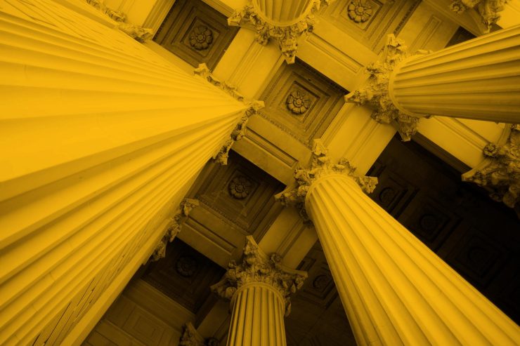 Upwards photo of bank or finance building columns
