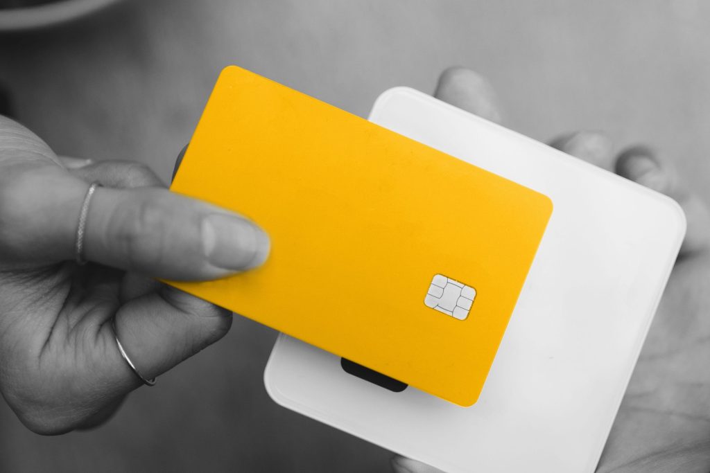 Bird's eye view of woman paying with contactless card