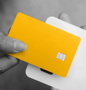 Bird's eye view of woman paying with contactless card